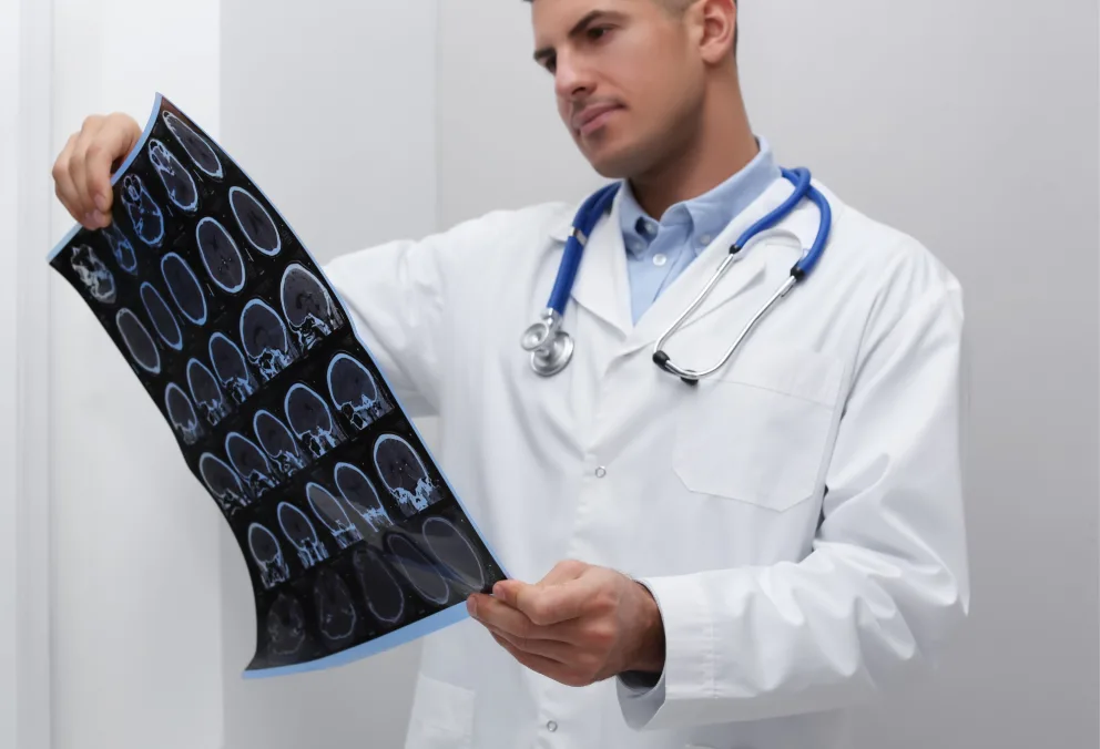 Doctor examining MRI results from patient with ALS